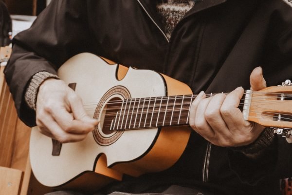 aset retired man learining guitar